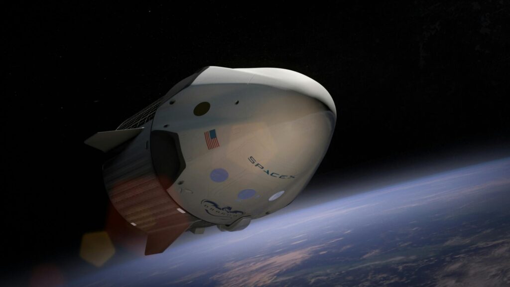 A SpaceX Dragon spacecraft orbiting Earth, captured in vivid detail against space.